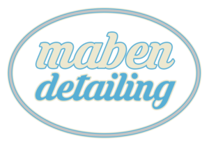 cream and blue logo with silver circle